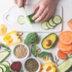 Vegan food background. Balanced food ingredients on white background. Cooking healthy salad.